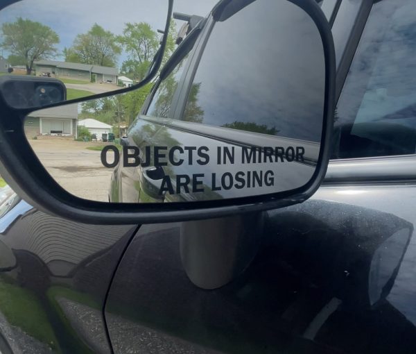 Objects in mirror are losing car decal, funny sticker